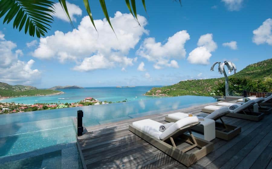 Serene place, offering a private escape with breathtaking views of a tropical bay, lush hills, and the endless blue sky.