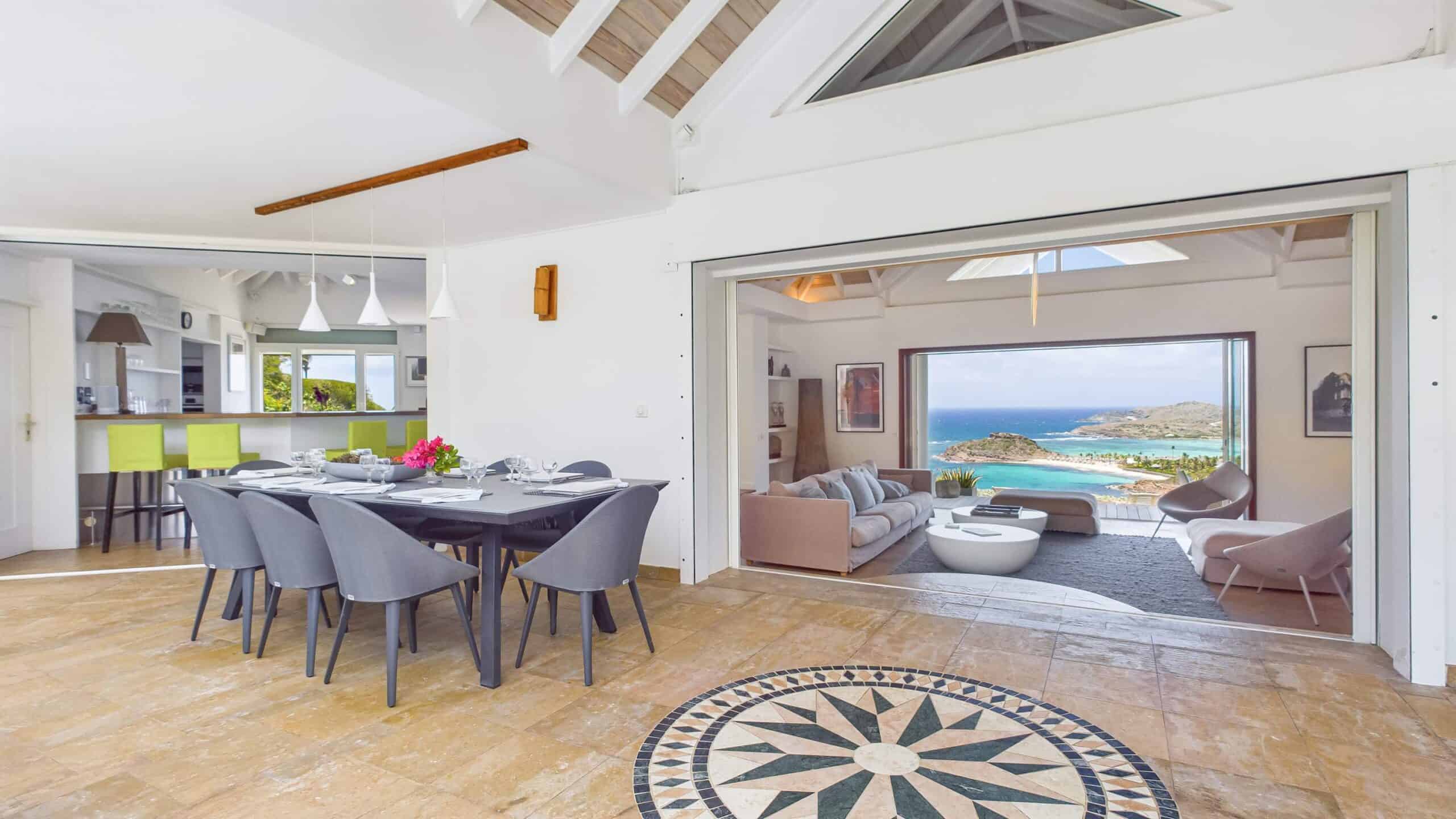 An open, airy space with stunning ocean views, blending indoor elegance with serene island beauty.